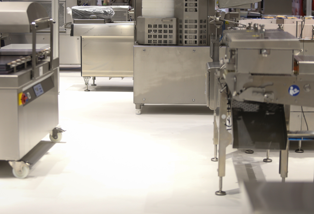 Resin being used for food safe flooring in a commercial kitchen.